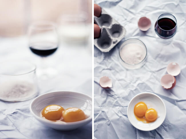 photograph of zabaglione mise en place: marsala wine, egg yolks, vanilla sugar, egg shells